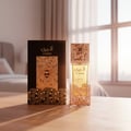 Lattafa Atheeri – Perfume bottle and box with bee and honeycomb design on a wooden table, soft light from window