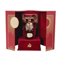 Lattafa Sakeena by Lattafa 100ml EDP Women — Red velvet perfume bottle with gold sunburst accents, presented in an open red box with gold detailing.