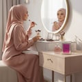 Lattafa Charm 100ml EDP for Women by LaMuse Lattafa — Woman applying makeup at vanity with perfume and box