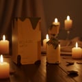 Lattafa Eclaire Banoffi — Perfume bottle and box on a wooden table with lit candles and scattered wooden petals.