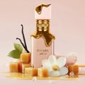 Lattafa Eclaire by Lattafa 100ml EDP Women — Pink bottle with gold dripping accents, surrounded by caramel cubes, vanilla