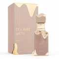 Lattafa Eclaire by Lattafa 100ml EDP Women — Perfume bottle and box with gold accents and Arabic text.