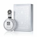 Lattafa Fakhar Platin — Silver round perfume bottle with ornate cap and embossed box with intricate pattern