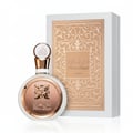 Lattafa Fakhar Rose Gold by Lattafa 100ml Women — White perfume bottle with rose gold accents and ornate emblem next to a