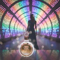 Lattafa Fakhar Rose Gold by Lattafa — White perfume bottle with gold accents in a colorful, blurred tunnel with a