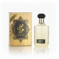 Lattafa Golden Oud — A gold and black patterned box sits next to a clear glass perfume bottle with a black ribbed cap.