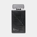 Lattafa Najdia Tribute by Lattafa 100ml EDP — Black perfume bottle with a silver leaf design and Arabic calligraphy, topped with a textured silver cap.