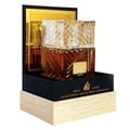 Lattafa Khamrah by Lattafa 100ml EDP Unisex — Amber glass perfume bottle with a clear, faceted cap, presented in a black and gold display box with a wood-grain textured base.