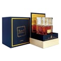 Lattafa Khamrah by Lattafa 100ml EDP Unisex — A dark blue box with gold trim and Arabic calligraphy sits beside a display of the Khamrah perfume bottle, featuring a faceted glass cap and amber liquid, presented on a wooden base.