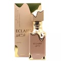Lattafa Eclaire — Perfume bottle with gold accents and matching box, featuring Arabic script.