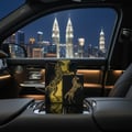 Lattafa Lail Maleki by Lattafa 100ml EDP Unisex — Black perfume bottle and box with gold horse design, inside a luxury car with a city skyline at night visible through the window.