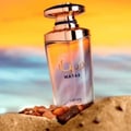 Lattafa Mayar by Lattafa EDP 100ml Woman — A clear glass perfume bottle with a rose gold cap, featuring Arabic script and 'MAYAR' text, placed on sand with small amber-like stones, against a blurred beach and sunset background.