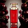 Lattafa Mayar Cherry Intense — Red glass perfume bottle with gold accents, surrounded by fresh cherries against a soft grey background.