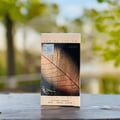 Lattafa Najdia in Gold by Lattafa 100ml Unisex — A perfume box featuring a close-up of a detailed, textured leaf on the front, with 'EAU DE PARFUM' and 'Lattafa' text at the top.