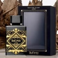 Lattafa Badee Al Oud Oud for Glory — Black perfume bottle with gold geometric design and black box with gold trim, set