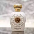Lattafa Opulent Musk by Lattafa 100ml EDP Unisex — White perfume bottle with ornate gold cap and embossed circular emblem on the front.