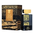 Lattafa Qasaed Al Sultan — Black and gold ornate box with a detailed cityscape illustration, next to a matching black perfume bottle with a gold cap.