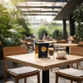 Lattafa Raed Luxe by Lattafa 100ml EDP Unisex — Kotak dan botol minyak wangi biru gelap dan emas diletakkan di atas meja kayu bersebelahan cawan kopi dengan latte art, dengan kehijauan subur di latar belakang.