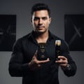 Lattafa Raghba for Men Lattafa 100ml EDP — Man in black shirt holding a black perfume bottle with gold accents and a matching black deodorant spray with gold accents.