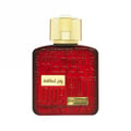 Lattafa Ramz Gold Lattafa Woman 100ml EDP — Red glass perfume bottle with embossed words and gold cap, featuring Arabic text and 'RAMZ LATTAFA' label.