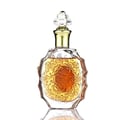 Lattafa Rouat Al Oud by Lattafa 100ml EDP Unisex — Clear glass perfume bottle with ornate gold floral embossing and a decorative crystal and gold cap, filled with amber liquid, isolated on a white background with reflection.