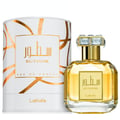 Lattafa Sutoor 100ml EDP for Women — A white cylindrical box with gold geometric patterns and a gold-capped glass perfume bottle with a square label.