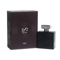 Lattafa Pride Wajood — Black perfume bottle with a silver cap next to its dark brown textured box with Arabic calligraphy and 'Wajood' text.