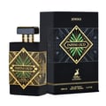 Maison Alhambra Infini Oud Joyous – Black perfume bottle with gold geometric design and green accents, alongside its black and gold patterned box.