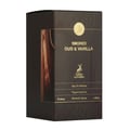 Maison Alhambra Smoked Oud & Vanilla — A dark brown perfume box with a wood grain texture and a gold emblem. Features text "SMOKED OUD & VANILLA" and a deer silhouette.