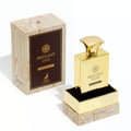 Maison Alhambra Brulant Oud — Gold perfume bottle and its wooden-patterned box, both featuring the Brulant Oud name and a deer logo, set against a white background.