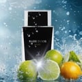 Maison Alhambra Dark Door Sport Men 100ml EDP — A dark bottle of Dark Door Sport perfume with water splashes, surrounded by fresh limes and a lemon slice.