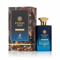 Maison Alhambra Ethnic Oud 100ml EDP — A blue glass perfume bottle with a gold cap and a decorative box with floral and abstract patterns, set against a white background.
