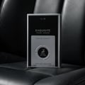 Maison Alhambra Exquisite Club By Maison Alhambra For Men 100ml — A black and silver box of Eau de Parfum for men, featuring a deer logo and text details, placed on a dark textured surface.