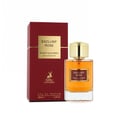 Maison Alhambra Exclusif Rose — A maroon box with a gold square label sits next to a clear glass perfume bottle with a gold cap and amber liquid.
