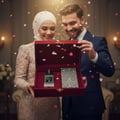 Maison Alhambra Extravagant Lover by Maison Alhambra – 100 ml, a couple in elegant attire opening a red velvet gift box containing a perfume bottle and a card, with pink heart confetti falling.