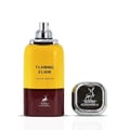 Maison Alhambra Flaming Elixir — A two-toned bottle of yellow and maroon perfume with a silver spray nozzle and cap, next to its square silver cap with a deer logo.