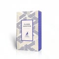 Maison Alhambra Flower Addiction by Maison Alhambra for Him 100ml — A rectangular perfume box with a geometric pattern of blue and beige lines on the front and sides, featuring a central white label with the product name, a deer silhouette, and brand details.