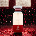 Maison Alhambra Forbidden Love by Maison Alhambra 80ml EDP Women — Botol minyak wangi kaca jernih dengan tapak merah, penutup berjalur putih dan merah, serta logo rusa, berlatar belakang gelap berkilauan merah.
