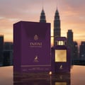 Maison Alhambra Infini Intoxicating Cherry — Purple perfume bottle and box set against a city skyline at sunset.