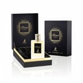 Maison Alhambra Kismet For Men by Maison Alhambra 100ml Man — Black gift box with gold glitter accents, open to reveal a clear glass perfume bottle with a gold cap and label, set on black satin lining.