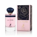 Maison Alhambra La Voie by Maison Alhambra 100ml for Her — Pink perfume bottle with a dark blue marbled cap and gold accents, next to its matching pink box with a black floral design.