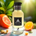 Maison Alhambra Jean Lowe Immortel by Maison Alhambra 100ml EDP Men — Clear glass perfume bottle with yellow liquid, black label featuring white floral design and text, surrounded by sliced grapefruit, orange, rosemary sprigs, and ginger root.