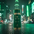 Maison Alhambra Sceptre Malachite — Green perfume bottle with gold accents, set on a wet, reflective city street at night with blurred neon lights and skyscrapers in the background.