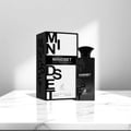 Maison Alhambra Mindset by Maison Alhambra – 100 ml For Man Eau de Parfum, presented with its black and white patterned box on a marble surface, with soft lighting.