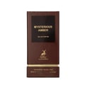 Maison Alhambra Mysterious Amber Eau de Parfum — A brown textured perfume box with a black label displaying "MYSTERIOUS AMBER" and "EAU DE PARFUM", featuring a gold deer logo and text "MAISON ALHAMBRA". The bottom has gold trim with "VAPORISATEUR - NATURAL SPRAY", "80ml.e", and "2.7 FL.OZ".