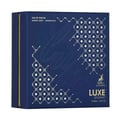 Maison Alhambra Luxe Journey — Dark blue perfume box with gold geometric patterns and 'Luxe Journey' text, featuring a deer logo.
