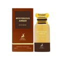 Maison Alhambra Mysterious Amber — A brown box and a glass perfume bottle with a gold cap, both featuring the product name and brand logo.