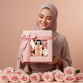 Maison Alhambra Olivia by Maison Alhambra 80ml EDP — Woman in hijab holding a pink gift box with roses and a perfume bottle inside, surrounded by pink roses.