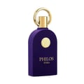 Maison Alhambra Philos Pura by Maison Alhambra 100ml EDP Man — A deep purple velvet-textured perfume bottle with a gold circular emblem and a gold ring cap, set against a white background.