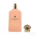 Maison Alhambra Decadent Dream — Pink perfume bottle with gold spray nozzle and cap, with a gold deer emblem and text on the bottle.